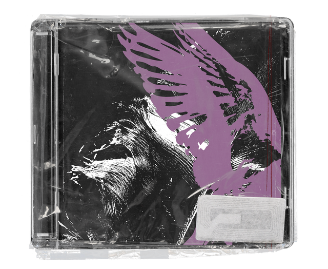 CD jewel case in clear shrink wrap. The cover is black with a lilac feathered wing sweeping across it and white dry-brush strokes, with a silver security tag in the lower corner.