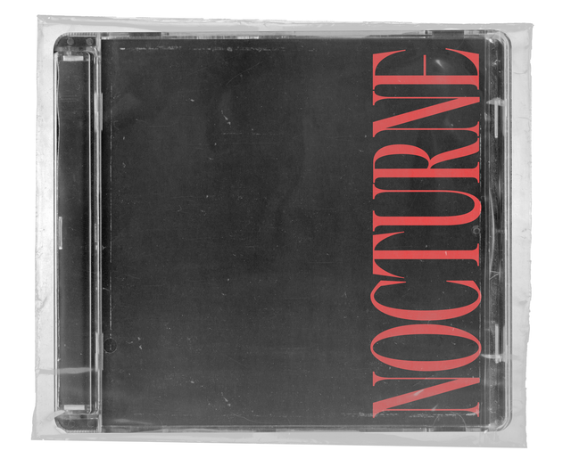 CD jewel case in clear shrink wrap. The cover is black with the word 'NOCTURNE' set vertically in tall red serif capitals along the right edge.