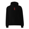 Front view of a solid-colored oversized-hoodie. An embroidered graphic is centered on the chest, featuring two large East Asian characters stacked vertically, rendered with a high-contrast, sketchy texture. The characters spell out “Acheron”.