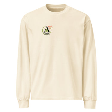 Front view of a solid-colored longsleeve. A small graphic on the left chest features a circular emblem containing a large, pixel-art style letter 'A'. A small, outlined star symbol is next to the emblem.