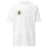 Front view of a solid-colored shirt. A small graphic on the left chest features a circular emblem containing a large, pixel-art style letter 'A'. A small, outlined star symbol is next to the emblem.