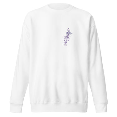 Front view of a solid-colored sweatshirt. A small, vertical graphic on the left chest features the text “Memories" in an elegant, high-contrast script font, alongside a small block of horizontal text.