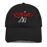 A black distressed baseball cap shown from the front. The cap features red embroidered text that reads "Burnice" in a Gothic or stylized font. Below "Burnice," there's a white embroidered graphic resembling crossed axes or a stylized 'X'. The cap has intentional rips and fraying on the brim and crown, giving it a distressed look.