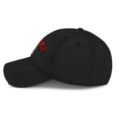 A black distressed baseball cap shown from a front-right angle. The cap features red embroidered text, with the right side of the word "Burnice" visible in a Gothic or stylized font, on the front. The white graphic below it is mostly obscured. The cap has intentional rips and fraying on the brim and crown.