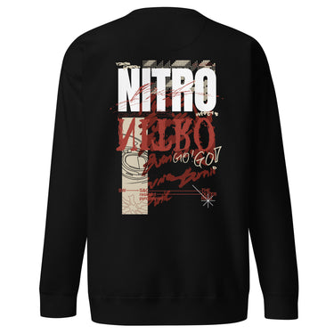 Back view of a solid-colored, oversized sweatshirt. A large, vertical collage graphic with a distressed aesthetic is centered on the upper back. It features the bold text "NITRO", a graffiti-style word, a line drawing of an biker helmet, and various other textures and symbols.