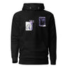 Front view of a solid-colored, hoodie. The chest features two separate collage-style graphics. One is a vertical rectangle containing a high-contrast illustration of a thorny bush. The other graphic features a line drawing of a character's head and hair, with several star shapes and a solid rectangular background.
