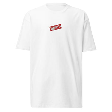 Front view of a solid-colored shirt. A small graphic on the center chest is designed to look like an embroidered sticker, featuring a high-contrast illustration of a fish skeleton inside a rectangular frame.