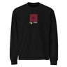 Front view of a solid-colored, longsleeve. A small graphic is centered on the chest, featuring a solid vertical rectangle containing a four-pointed star. The word "LYRA" is next to it, and two small charm-like shapes hang from the bottom.