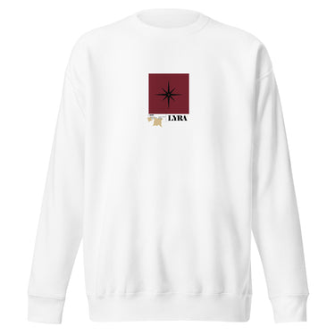 Front view of a solid-colored, sweatshirt. A small graphic is centered on the chest, featuring a solid vertical rectangle containing a four-pointed star. The word "LYRA" is next to it, and two small charm-like shapes hang from the bottom.