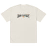 Front view of a solid-colored oversized-tee. A graphic centered on the chest features the words "IRON CAVALRY" in an elegant, arched serif font, with a small icon of two mirrored axe heads in the center.