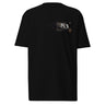 Back view of a solid-colored shirt. A large, symmetrical graphic is centered on the upper back. It features the text "PURSUITS end" integrated with a large, ornate, star-like emblem. Below are two fine-line illustrations of hands, one holding a key and the other a lock.