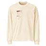 Front view of a solid-colored longsleeve. A small graphic on the left chest features a fine-line illustration resembling a smoke outline, with several blocks of technical-style text labeling different areas.