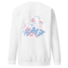 Back view of a solid-colored sweatshirt. A large, playful collage graphic is centered on the back. It features large, abstract blob-like letterforms, line drawings of polaroid frames, and various high-contrast scribbles and floral shapes.
