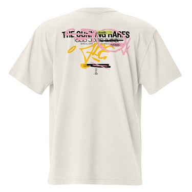 Back view of a solid-colored oversized-tee. A large, chaotic collage graphic on the upper back features multiple layers of text in various fonts, including "THE CUNNING HARES". A central, high-contrast emblem shows a cracked smiley face, surrounded by abstract scribbles and brush strokes.