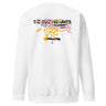 Back view of a solid-colored sweatshirt. A large, chaotic collage graphic on the upper back features multiple layers of text in various fonts, including "THE CUNNING HARES". A central, high-contrast emblem shows a cracked smiley face, surrounded by abstract scribbles and brush strokes.