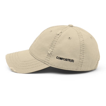 Khaki distressed baseball cap, side view, displaying black embroidered text 'COMPOSITE(S)' on the side panel.