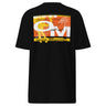Black tee, back view, showcasing a large abstract graphic in orange, yellow, black, and white. The design includes bold typography, Japanese characters, geometric shapes, and layered text overlaid with dynamic line art and circular motifs.