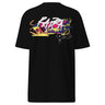 Back view of a solid-colored shirt. A large, horizontal graphic on the upper back features a stylized, graffiti-like word spelling “RAPPA” layered over a wide smear of high-contrast brush strokes imitating graffiti splatter. To the side are smaller, schematic graphics including a compass rose and blocks of text.