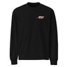 Front view of a solid-colored longsleeve. A small, horizontal graphic on the left chest features the number "011" in a stylized font, layered over a starburst shape.