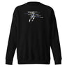 Front view of a solid-colored, sweatshirt. The chest features a collage graphic with a textured, high-contrast vertical shape at its center. This is layered with multiple words in various fonts, such as "absolutes" and "burden," which are crossed by thin horizontal lines.