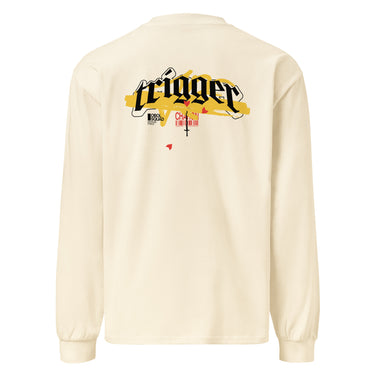 Back view of a solid-colored, longsleeve. A large, horizontal graphic on the upper back features the word "trigger" in a high-contrast, graffiti, streetwear-style font. This is layered over a wide brushstroke shape and several smaller text elements, including a barcode and a cross symbol.