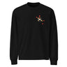 Front view of a solid-colored, longsleeve. A small graphic on the left chest features a circle containing an 'X' mark, with several small, stylized pointer shapes scattered around it, forming a type of crosshair.