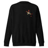 Front view of a solid-colored, sweatshirt. A small graphic on the left chest features a circle containing an 'X' mark, with several small, stylized pointer shapes scattered around it, forming a type of crosshair.