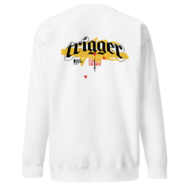 Back view of a solid-colored, sweatshirt. A large, horizontal graphic on the upper back features the word "trigger" in a high-contrast, graffiti, streetwear-style font. This is layered over a wide brushstroke shape and several smaller text elements, including a barcode and a cross symbol.