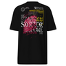 Back view of a solid-colored shirt. A large, complex collage graphic on the upper back features the text "THE STARS SHATTER BEFORE YOU" in a distressed style. The design is layered with abstract textures, barcodes, wireframe globes, and a web of lines creating a shattered glass effect.