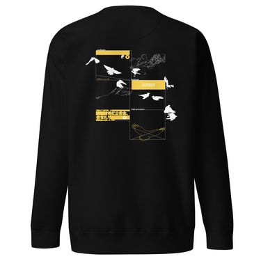 Back view of a sweatshirt. A large collage graphic is arranged in a grid of rectangular frames. The design features multiple high-contrast silhouettes of birds in flight, a topographical map-like shape, and several small blocks of text and abstract symbols.