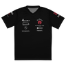 Front view of a sports jersey in black. A graphic-forward arrangement of stylized sponsor-style logos covers the chest in two columns — featuring marks reading "ENCORE X," "the Tavern," "PUNCHLINE Tuning," "blocked. media management," "lies & palette Co.," "144," and "Engage," alongside a circular flame emblem. Additional graphic details on both sleeves in white and deep crimson on black.
