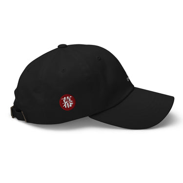 Side view of an baseball cap in black. Evernight inspired design features an embroidered red circular patch on the side featuring a stylized character. Adjustable strap with metal clasp visible at the back.