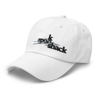 3/4 view of an baseball cap in white. The embroidered logo "spook shack" is shown on the front panel, designed with a stylized font and layered over abstract horizontal brush strokes.