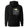 Back view of an hoodie in black. Design shows a rectangular grayscale graphic centered on the upper back showing a lighthouse shining into darkness. Above the image is a yellow label reading “LIGHTKEEPER,” surrounded by thin white grid lines and handwritten script text for a technical, conceptual design aesthetic