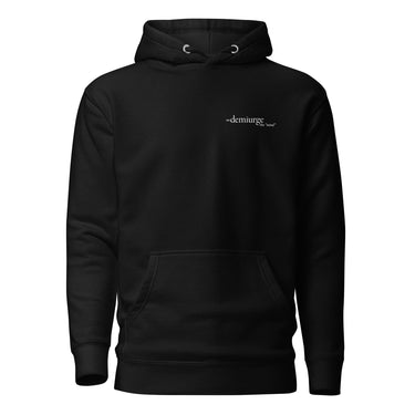 Front view of an hoodie in black. Design features a small, minimal text print placed on the upper left chest. The word “demiurge” appears in a clean serif font, preceded by a small infinity-shaped symbol. Just beneath it, in tiny handwritten script, the phrase “the mind” is printed in quotation marks.