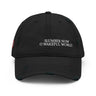 Front view of an distressed hat in black. Evernight inspired design, shows off-centered embroidered text leaning right that reads “SLUMBER NOW O WAKEFUL WORLD.”