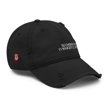3/4 view of an distressed hat in black. Evernight inspired design shows embroidered text on the front reading “SLUMBER NOW O WAKEFUL WORLD.” The side panel shows a red circular patch with a character symbol.