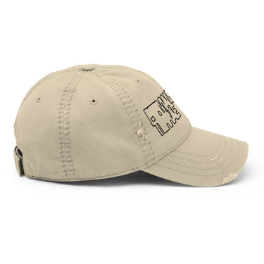 Side view of an distressed hat in khaki. The cap features a black outline graphic on the front panels with the stylized, blocky words 'PERMANSOR' and 'TERRAE' stacked on top of each other.