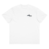Front view of a box tee in white, flat. Design features a small logo on the upper chest featuring the words "spook shack" in a stacked, stylized font, with abstract horizontal brush strokes layered behind the text.