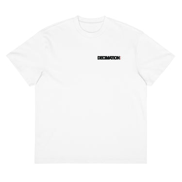 Front view of a box tee in white. A bold 'DECIMATION' wordmark sits on the left chest in solid black type, with a small red sparkle accent stamped beside it.