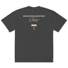 Back view of an oversized tee in Faded Black. A stacked graphic fills the upper back: "AIRSPACE PATROL DEPARTMENT" in heavy white capitals, "GLORIA NOS DUCIT" in smaller gold capitals beneath it, then "L'Azur" in a large gold script with a long trailing flourish. Below sit a small white box lettered "FIRST SPEAR" in black, a weathered gold seal stamp carrying two characters, and "gen 5" in gold.