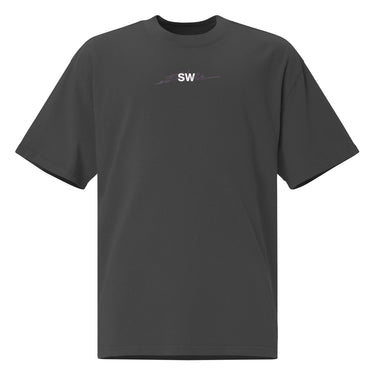 Front view of a Oversized Tee in Faded Black. A small chest graphic reading "silvie" in a bold, hand-lettered signature style, framed by loose script strokes and star accents.