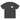 Front view of an oversized tee in faded black. A small halftoned panel sits on the left chest: a bare, leafless tree standing over dark undergrowth, printed with a woven fabric texture and rough torn edges. Below it the words "pas seul" are set in a fine serif, the letters scattered and stepping down to the right.