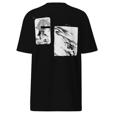 Back view of a t-shirt in black. A large two-panel composition fills the back. On the left, a halftoned portrait with a solid black bar across the eyes; to the right, a wider panel of sweeping feathers in heavy contrast. The words "pas" and "d'aveu" float above them in a fine serif, the letters spaced apart and drifting.
