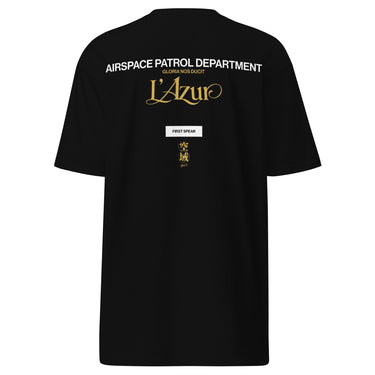 Back view of a t-shirt in Black. A stacked graphic fills the upper back: "AIRSPACE PATROL DEPARTMENT" in heavy white capitals, "GLORIA NOS DUCIT" in smaller gold capitals beneath it, then "L'Azur" in a large gold script with a long trailing flourish. Below sit a small white box lettered "FIRST SPEAR" in black, a weathered gold seal stamp carrying two characters, and "gen 5" in gold.