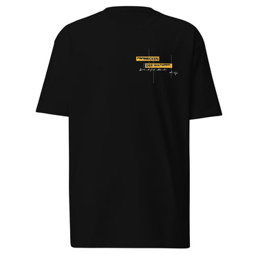 Front view of an t-shirt in black. Design is positioned on the upper left chest. Design features a yellow rectangular label reading “CONNECKEN,” smaller text “DER WÄCHTER,” and fine white script lines and coordinates below it.