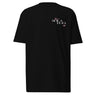 Front view of a t-shirt in black. A small left-chest graphic reads 'SOLA EGO' in a high-contrast serif, split across two lines, with two four-pointed star accents in dusty pink flanking the type.