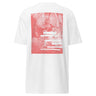 Back view of a t-shirt in white. A large coral pink poster panel fills the upper back, printed with a stylized winged figure in soft tonal linework set against a bank of clouds. Horizontal white bars redact most of the text, leaving the words "she, who silences the ether" legible between them, with faint handwritten script and a small circular seal layered underneath. An expressive, editorial, graphic-forward composition.