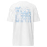 Back view of a t-shirt in white. A large square collage in pale sky blue layers oversized fragmented lettering over clouds, handwritten script and geometric diagram lines. Numbered index strips read 'Total Unity', 'Genius-Villain Paradox' and 'Chain of Genesis', with smaller labels for 'experiment log' and 'tech status: unstable'. A thin border frames the panel, with the name set vertically down the left edge.
