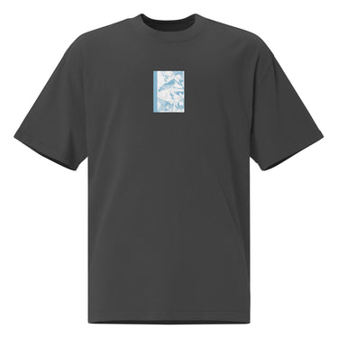 Front view of an oversized tee in black. Design is a bitmapped illustration of Seed from Zenless Zone Zero, in a small centered rectangular graphic on the chest. The graphic is composed of light tones.